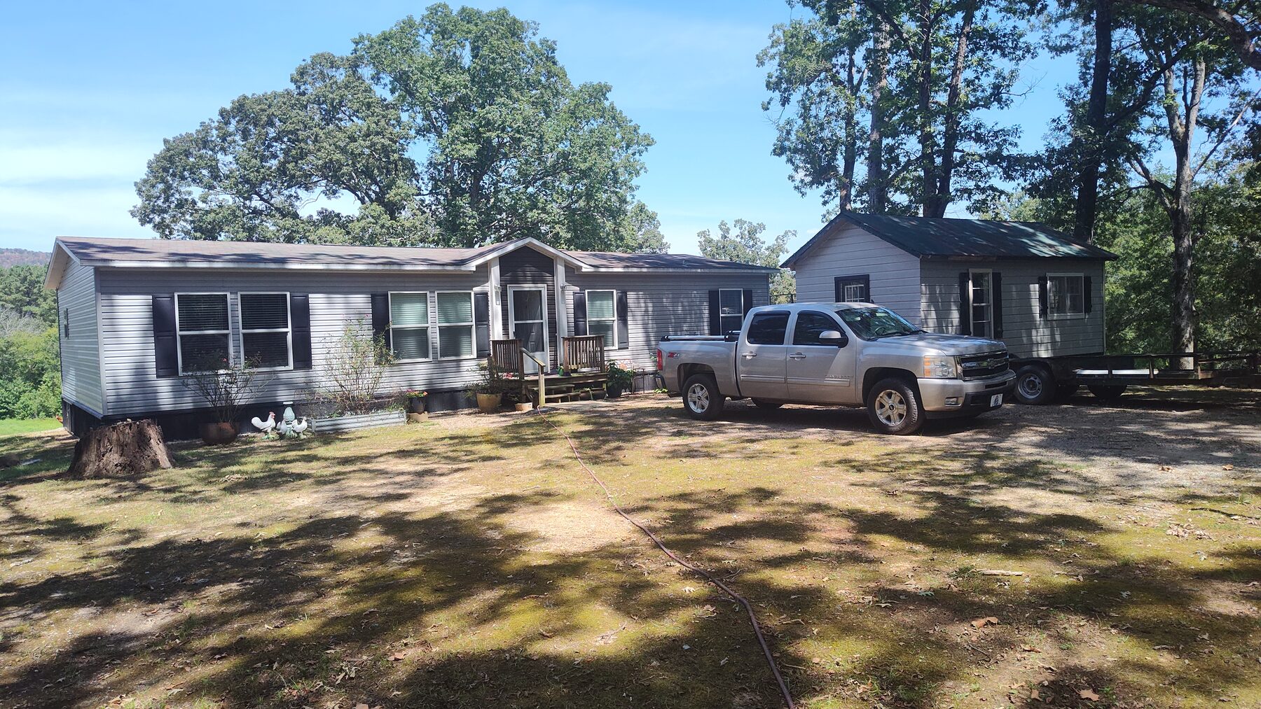 Front of the home and gravel driveway